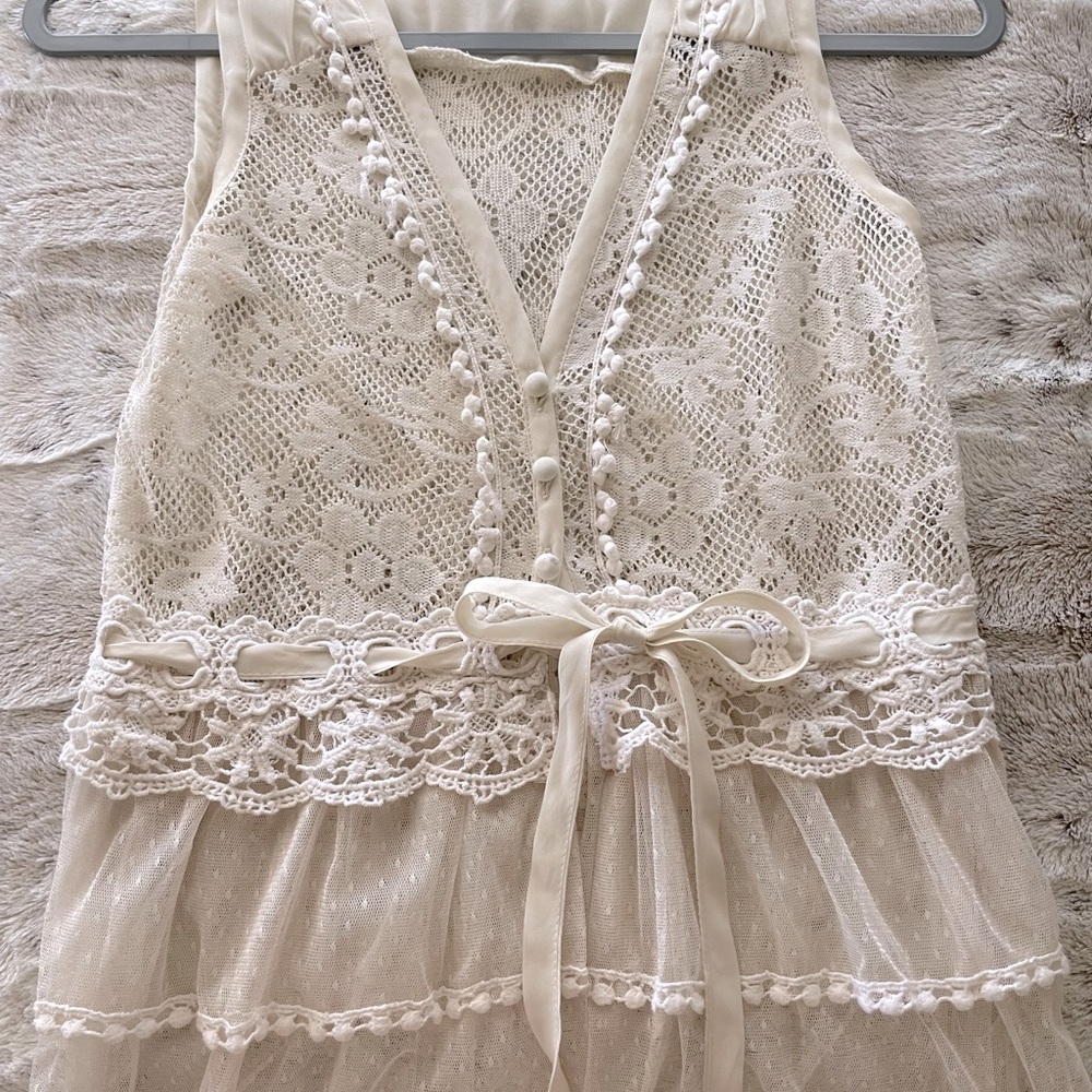 Very feminine lace vest.